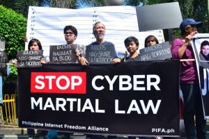 PIFA CyberCriminals pose for mugshots during the Black Tuesday 2.0 demonstrations in front of the Supreme Court on October 9, 2012: Photo by Irish Flores