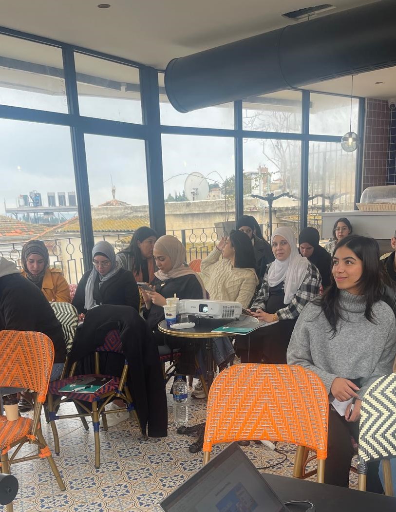 Photo: Participants of a digital security training organised by 7amleh listen to a presentation. 