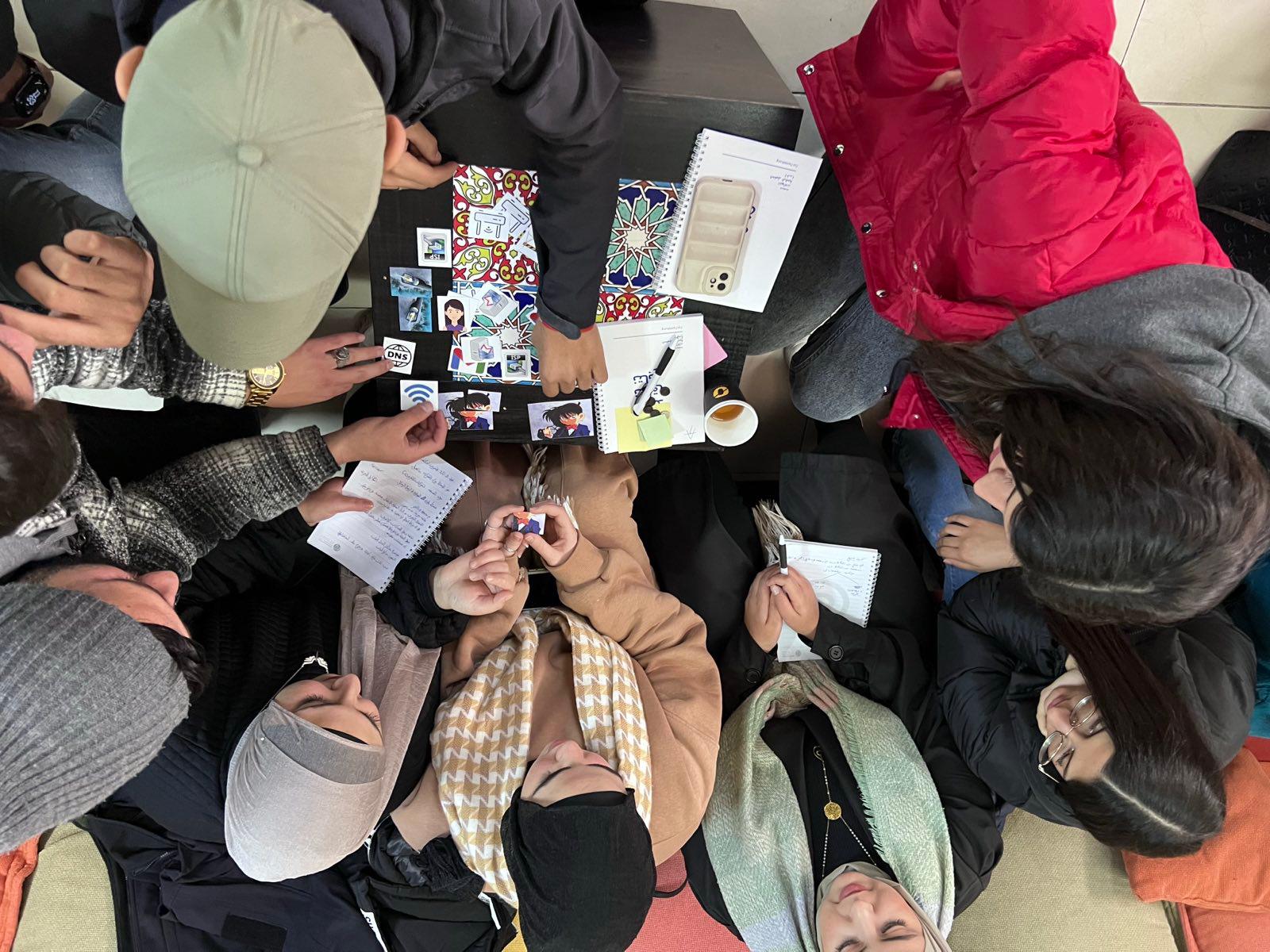 Photo: Participants of a digital security training organised by 7amleh listen to a presentation. 