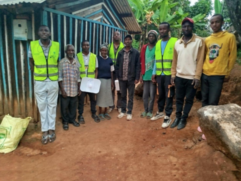 Photo by Athi. Installing a network relay from one of a community member’s home to link to mutiokiama health centre.