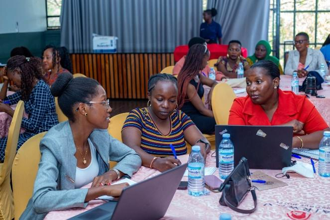 Participants during group discussions about creating a phishing email. Photo courtesy of WOUGNET.
